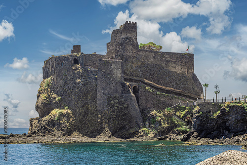 North side of the castle of Aci Castello. Norman-Swabian Castle of Aci Castello: Ruins of a fortress built, in 13th century, on an imposing cliff overlooking the sea. Catania province, Sicily, Italy