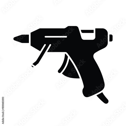 Black silhouette of a hot glue gun on a white background
