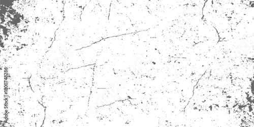 Grunge wall texture with old white paint and black dirt splash forming a pattern for design backdrop