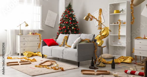 Canvas Print Interior of messy living room with sofa and tinsel after New Year party