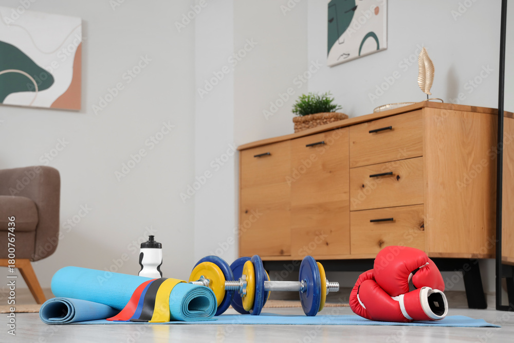 Fototapeta premium Sports equipment on floor in living room