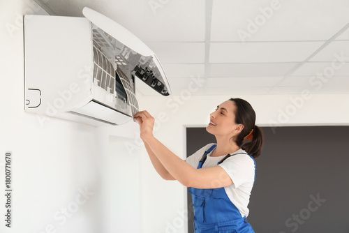 Female technician changing ...