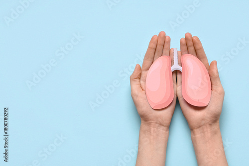 Female hands with paper lun...