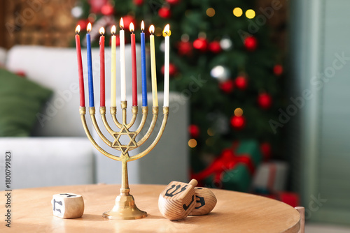 Menorah with burning candle...