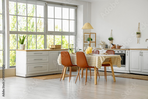 Served dining table with ca...