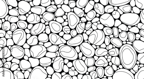 A close up view of many small smooth pebbles and stones closely packed together on a beach.