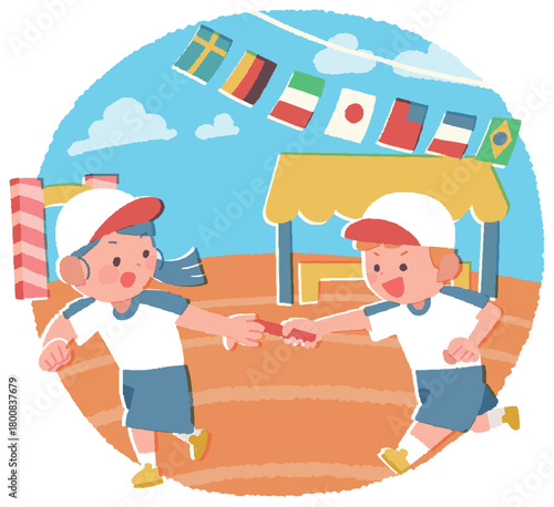 運動会のリレーでバトンを渡す小学生の男女
