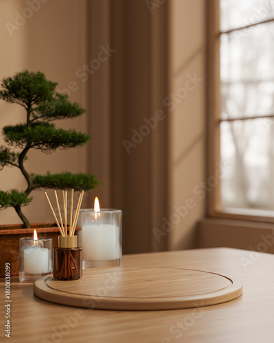 Fototapeta Naklejka Na Ścianę i Meble -  Wooden board tray with diffuser and aroma scented candle glass with bonsai tree at table in spa room