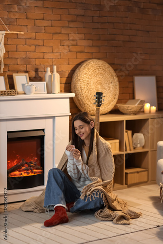 Young woman with warm plaid...