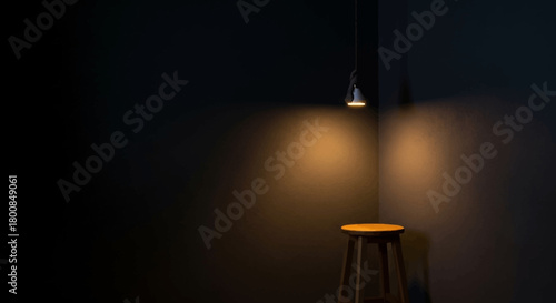 Minimalist Wooden Stool Illuminated by a Single Pendant Light