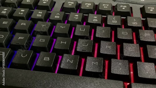 computer keyboard close up, gaming keyboard with bright backlight, close up of a cool gaming keyboard