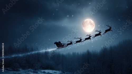 Fototapeta Naklejka Na Ścianę i Meble -  A silhouette of Santa Claus and his reindeer flying over a snowy forest under a full moon, with snowflakes falling and a dark blue sky with stars.