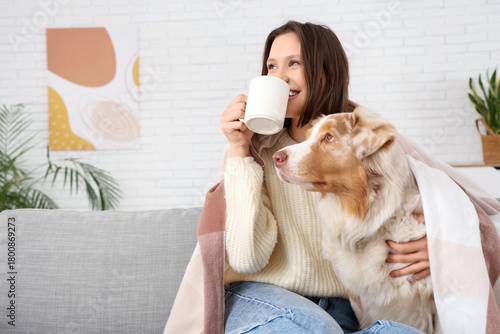 Young woman with cup of tea...