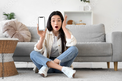 Shocked young woman with bl...