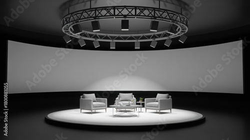 Modern studio stage with curved screen armchairs and lighting rig perfect for presentations and interviews rendered in monochrome