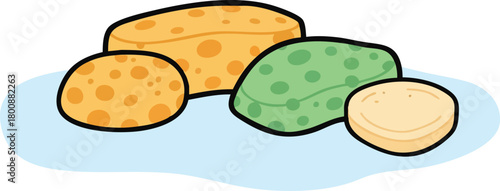 Group of Kitchen Sponges in Various Shapes and Colors on a Light Blue Surface