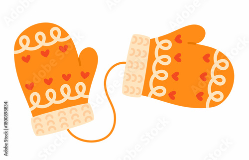 Knitted orange mittens with hearts. Cozy patterned mittens.