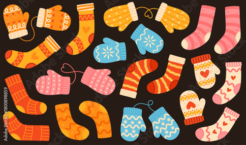 Set of knitted socks and mittens with patterns on a dark background.