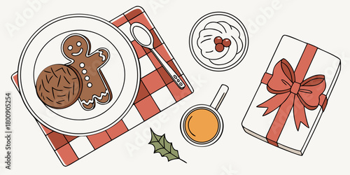 Festive christmas scene with gingerbread man cookie gift and drink on a checkered table cloth top view