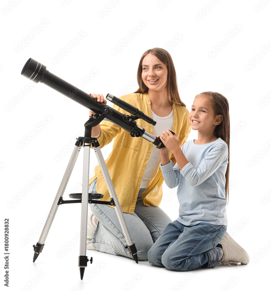 Fototapeta premium Little girl with her mother and telescope sitting on white background
