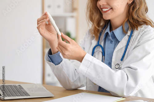 Female doctor with lancet p...