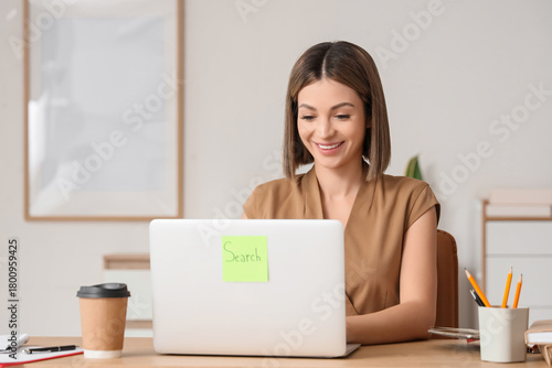 Young businesswoman using l...