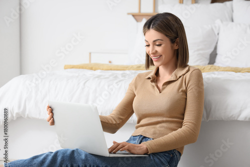 Beautiful woman using lapto...