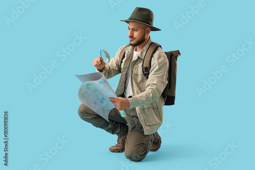 Male traveler with magnifie...