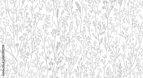 Detailed monochrome line art seamless pattern of various wildflowers and meadow grasses, creating a delicate botanical background.