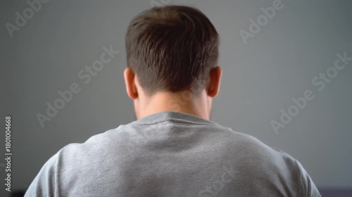 back view of the deep sigh release shoulders rise visibly on inhale drop heavily on exhale 