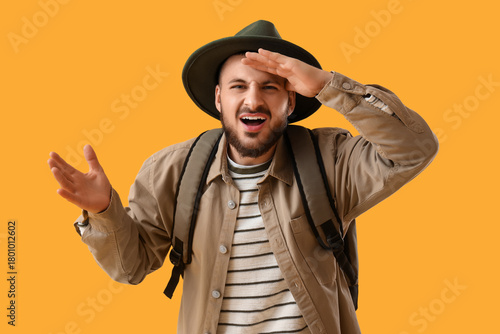 Young male tourist looking ...