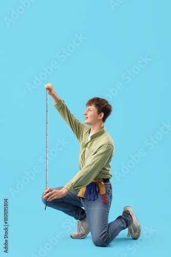 Young man measuring somethi...