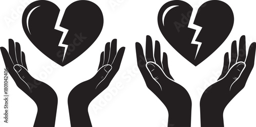 Two hands holding broken heart silhouette