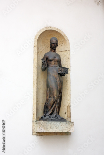 Statue of Dora Krupic, a character from the novel Goldsmith's Gold (1871) by August Senoa, placed on the western front of the Stone Gate, Zagreb 