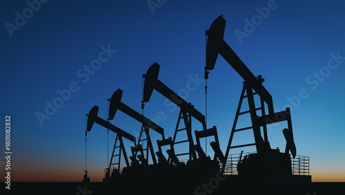 Silhouettes of oil pump jacks in a field at sunset, concept for petroleum industry, energy production, and oil prices. 3d rendering