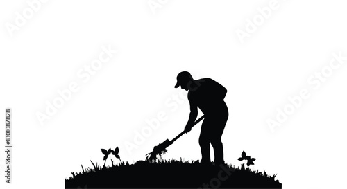 Silhouette of a gardener tending to plants in a grassy field.