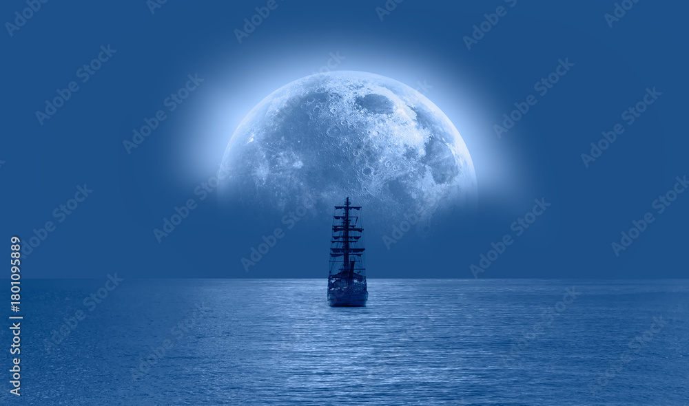 Obraz premium Sailing old ship in calm sea - Night sky with moon in the clouds 