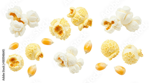 Assorted popped popcorn clusters with few corn kernels scattered on transparent background