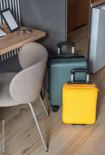 Luggage standing in hotel room ready for travel