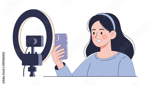 Young woman taking a selfie with ring light