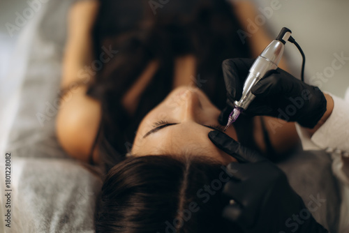 Woman receiving permanent eyeliner makeup procedure
