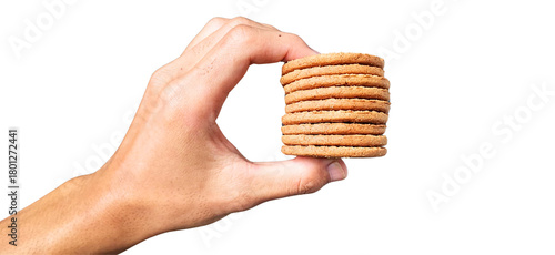 Close-up photo of a hand holding a crispy biscuit on a transparent background, suitable for culinary elements, food promotion materials, and versatile digital design use.
