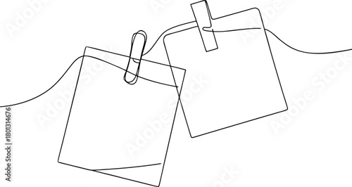 Two blank square notes hanging on a string with clips