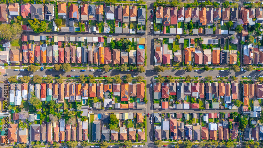 Fototapeta premium Aerial Panorama Drone View of a inner western Sydney Suburb of Ashbury Urban Sprawl and the terracotta roof tops streets and trees of Suburban Sydney NSW Australia