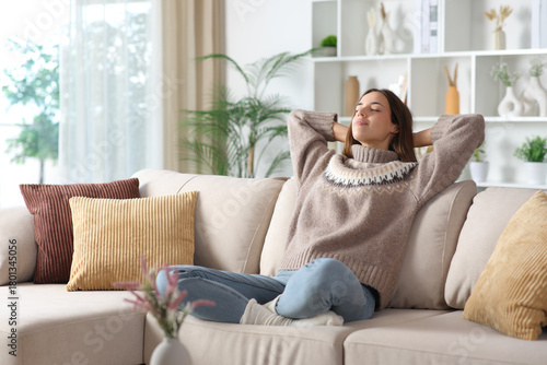 Fotografie Woman in brown relaxing in winter at home