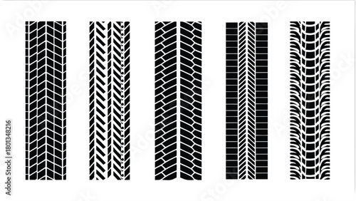 Distinct black tire tracks create varied patterns on a crisp white surface collectively