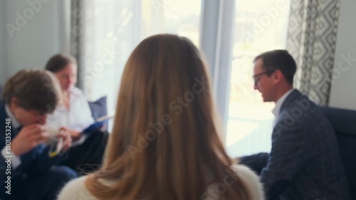 coffee brainstorm session, team casually sharing ideas over coffee between meetings in lounge, relaxed team of caucasian professionals discussing ideas and planning over coffee between meetings