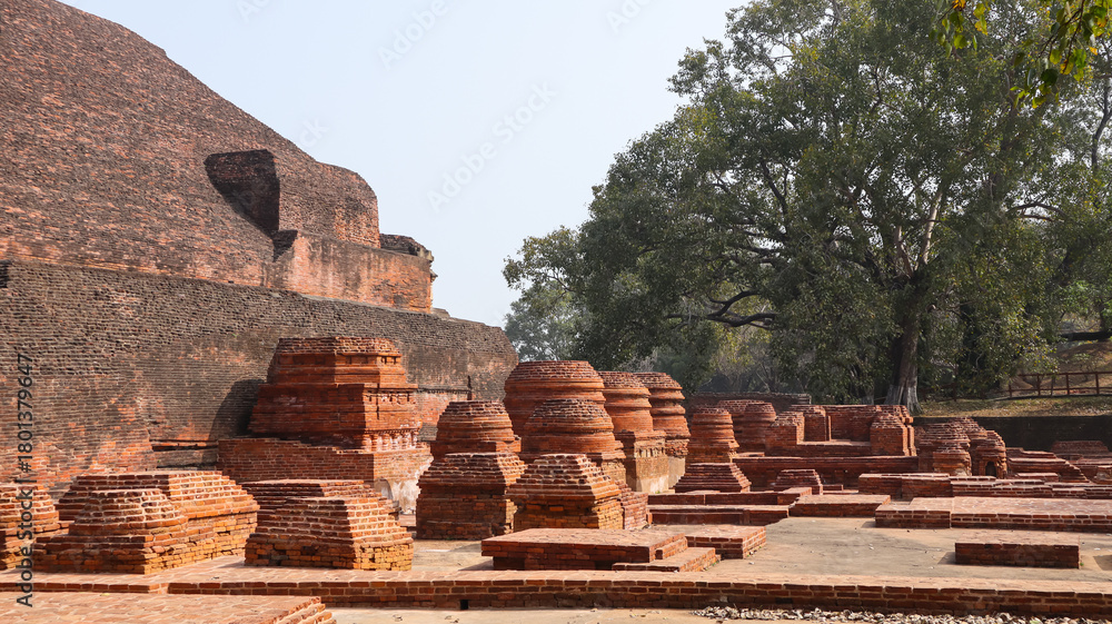 Fototapeta premium India, Bihar, Rajgir, View of Ancient Ruins of Worlds Oldest Nalanda University, The Red Brick Monuments With Ruin Buddha Vihara's Around Campus.