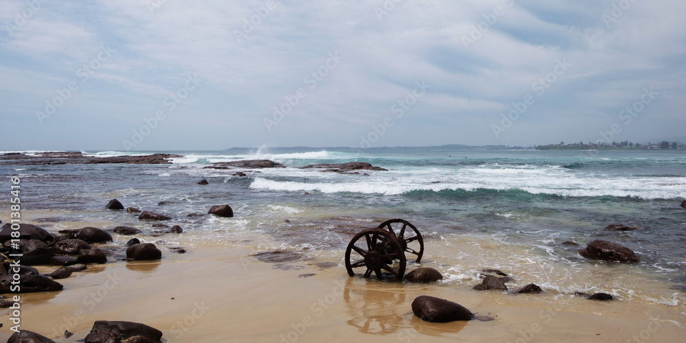 Obraz premium Rusted abandoned Wheels on a beach