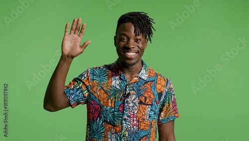 African American man waving hand on green screen.